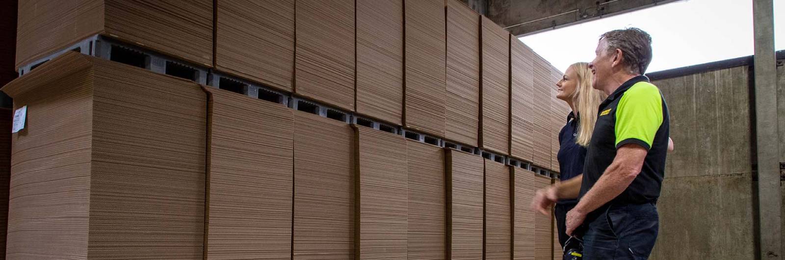 people looking at corrugated board